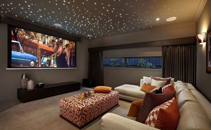 basement media room with starry ceiling