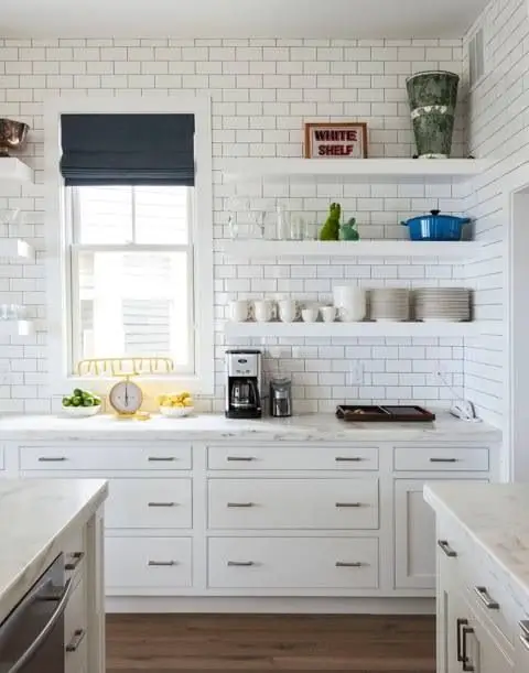 white kitchen with subway tile walls