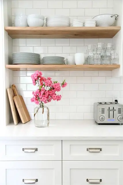 white kitchen with floating shelves