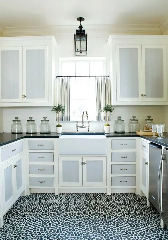 small kitchen with pebble stone floor