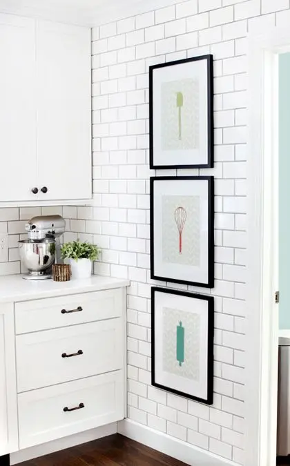 white kitchen with subway tile wall