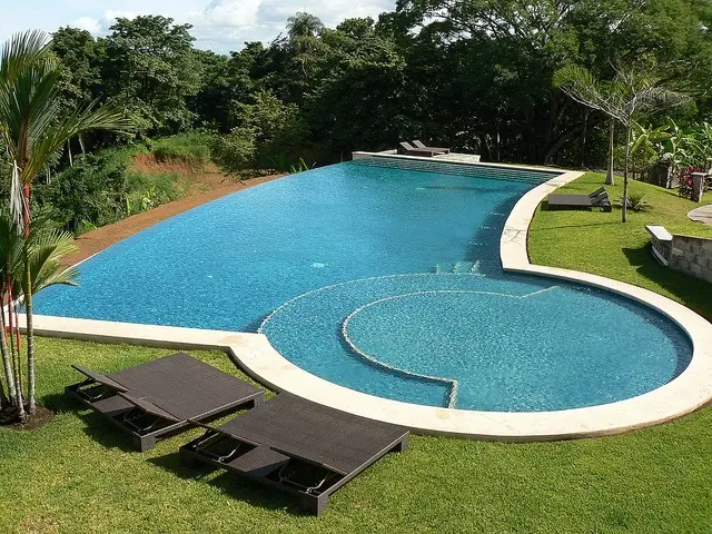 clear pool with jacuzzi