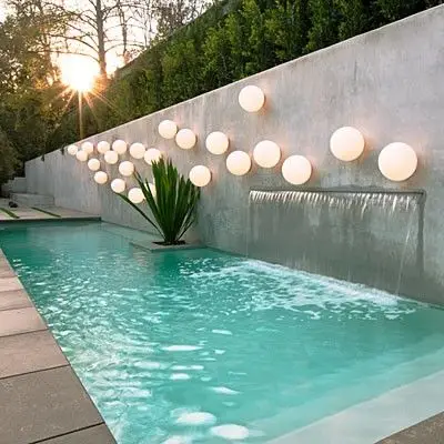 narrow pool with cascading wall