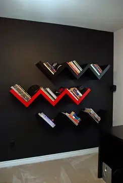 Chevron shelves on black wall