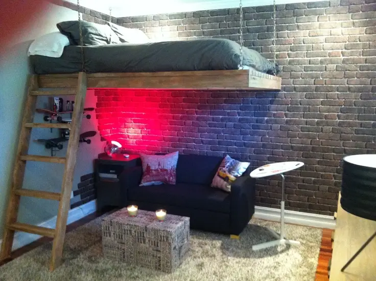 stripped and edgy bedroom with exposed brick wall