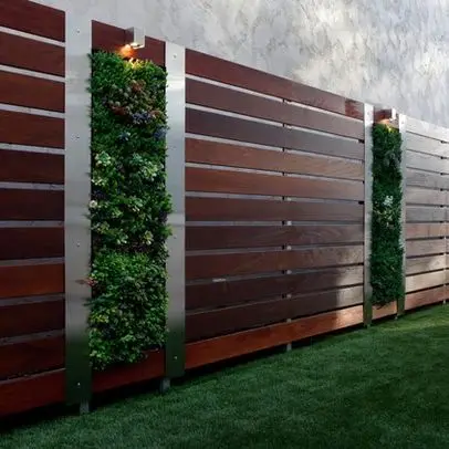 vertical succulent garden on a modern wood fence