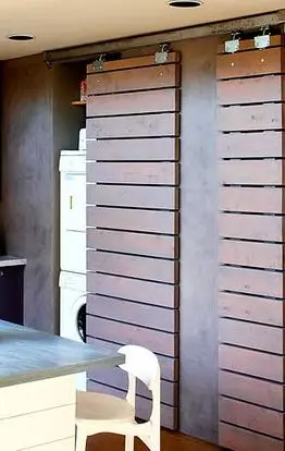 laundry with sliding barn doors