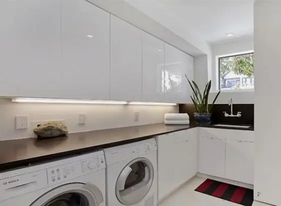 neat laundry with ample countertop space