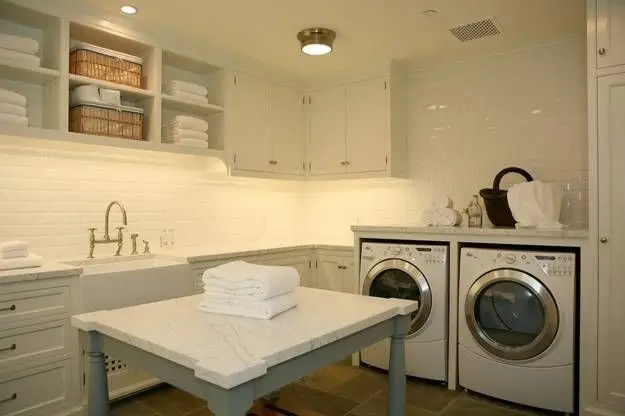 spacious laundry room with folding island