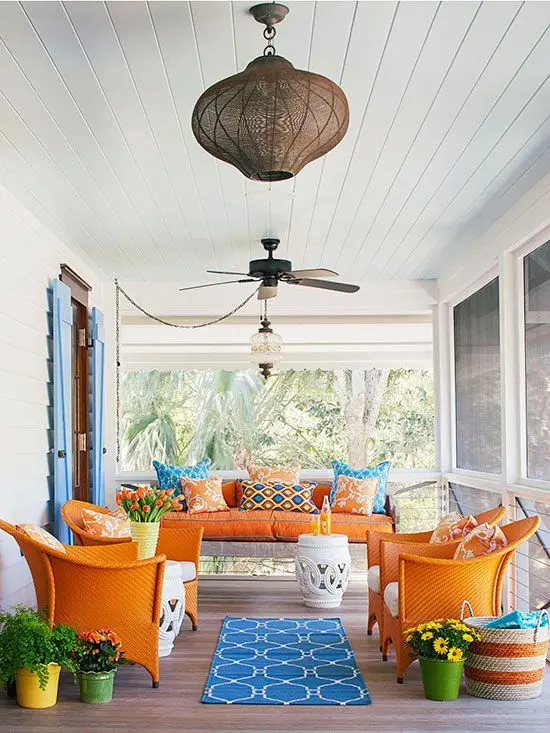 screened verandah with bright furniture