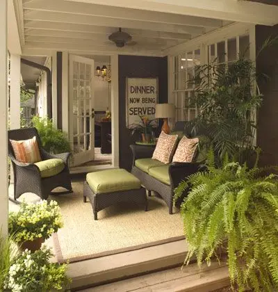 Relaxed Oasis front verandah: Green and grey, soft seating, nothing demanding attention. The kind of front that makes the