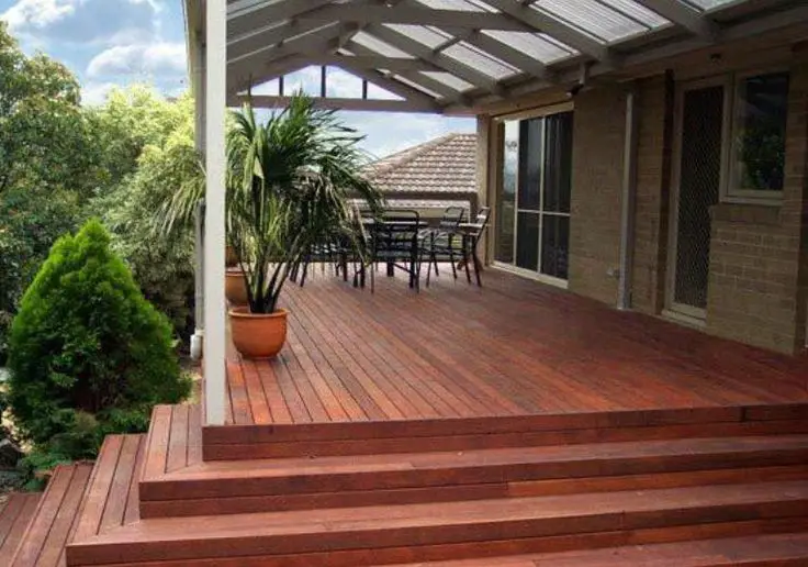 Rustic Modern front verandah: Warm timber decking, minimal furniture, straight lines. Nothing else