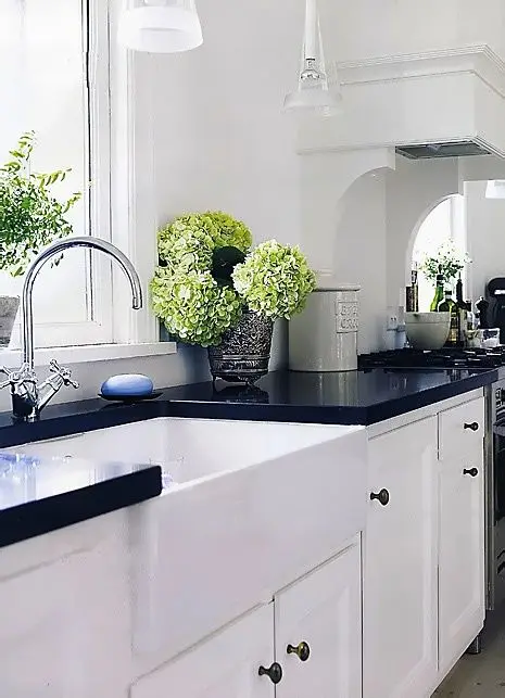 classic white kitchen with dark countertops