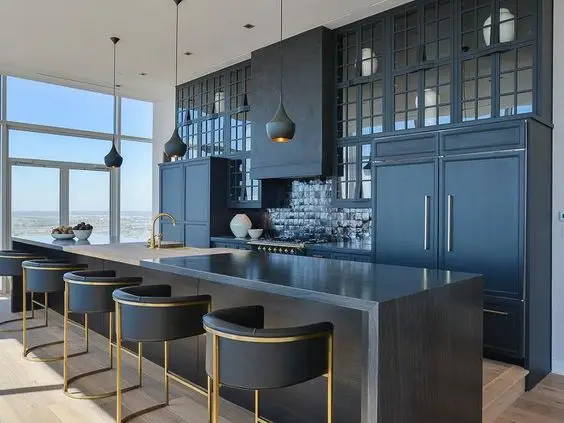 upscale dark kitchen with gold etchings