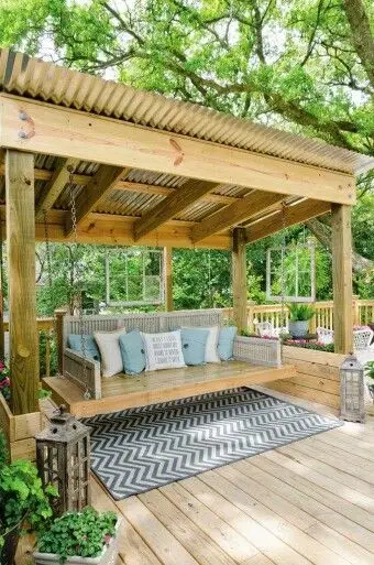 wooden pavilion with swing bed