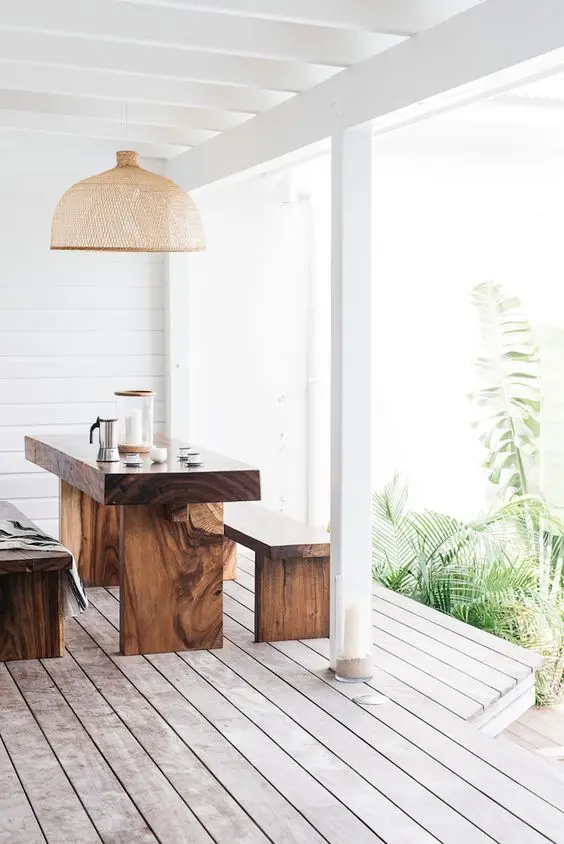 white deck with wooden dining set