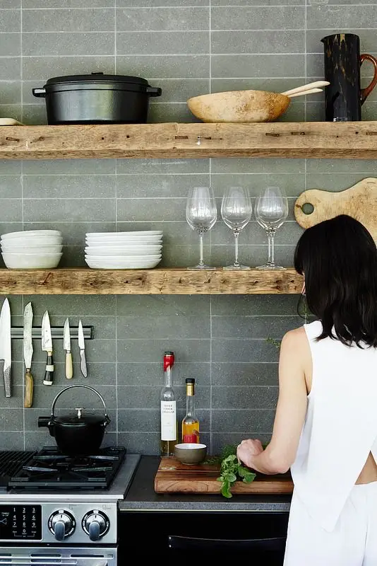 modern kitchen with rough wood floating shelves