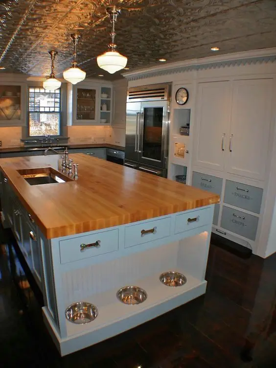 butcher's block kitchen island with pet feeding station