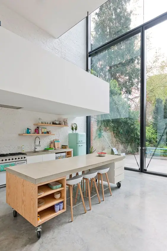 large airy kitchen with wheeled island