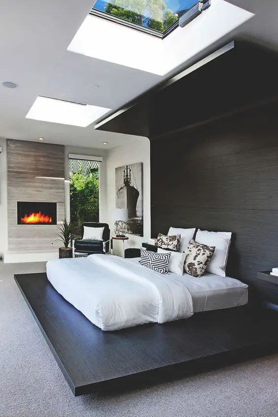 master bedroom with a skylight