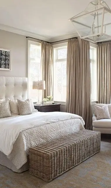 Wicker and White master bedroom: Natural hues are taking home decorating by storm. The charming wicker basket and muted