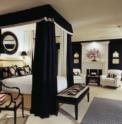 luxurious black and white master bedroom with canopy