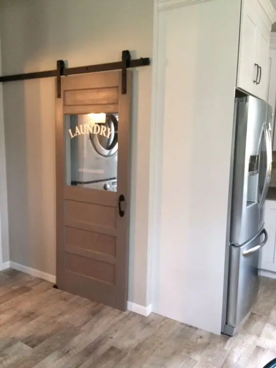 small laundry with barn door