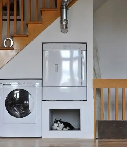 washer and dryer under the stairs