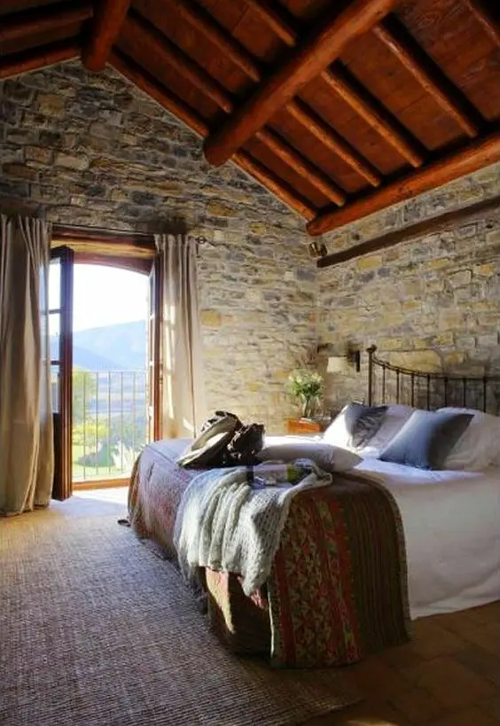 master bedroom with stone brick walls