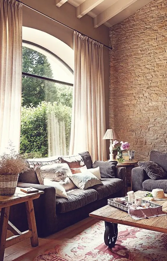 cosy living room with weathered stone wall