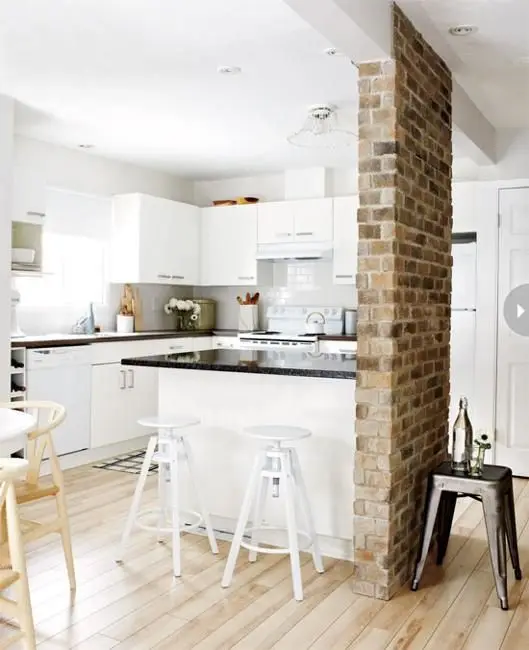cottage kitchen with brick room divider