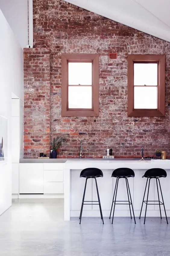 contemporary kitchen with rough brick wall