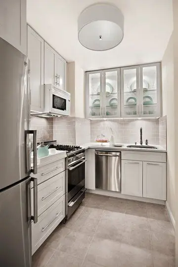 Screened and Lighted Cabinets small kitchen: Small kitchens appear larger when it’s white, uncluttered and well-lighted. If