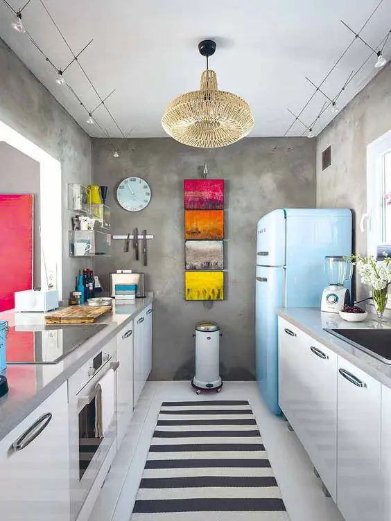 Modern Galley Kitchen: Eclectic, modern and fabulous. This small kitchen makes up its lack of space by going big on design
