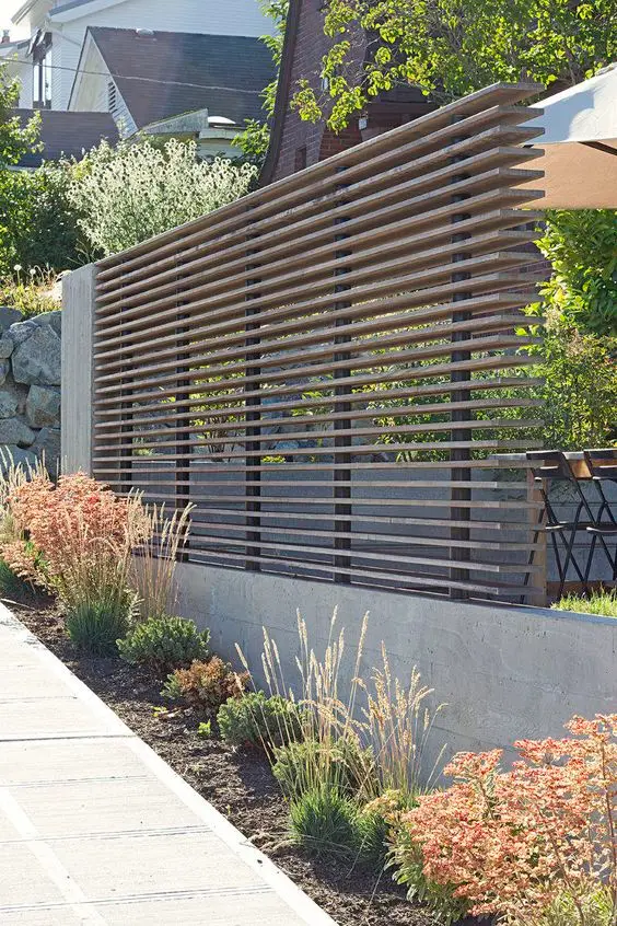 Horizontal Stacked Fence: Slats stacked in offset layers so the fence has real depth instead of a flat face