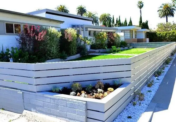 Barn Wood Style Fence: A low fence of weathered barn-style boards