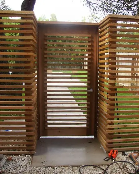 Horizontal Wood Fence: Widely spaced horizontal rails, farm-fence logic brought to a suburban block