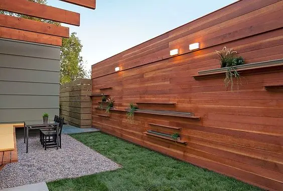 Minimalist Rustic Wall fence: Think of the inside face of a boundary fence as a wall of your outdoor room