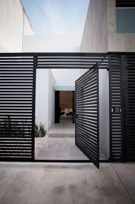 Modern Black Iron Fence: Clean-lined black iron with a swivel gate, and none of the scrollwork that usually comes with iron