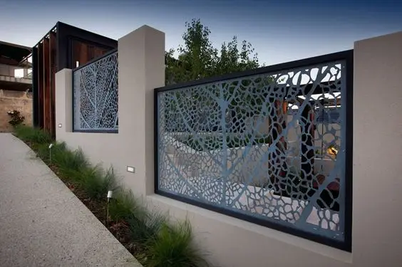 Etched Metal Screen Panels fence: Fine etched screen panels fixed over an existing steel bar fence