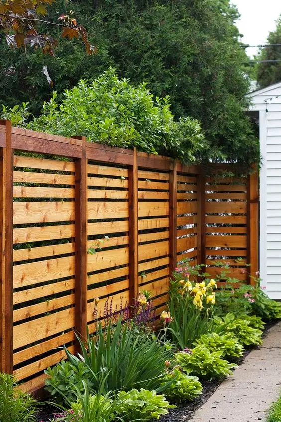 Modern Pallet Fence: Pallet timber, left raw, as a garden boundary