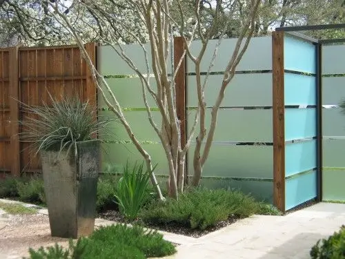 Frosted Glass Fence: Frosted glass panels let light through while blocking the view