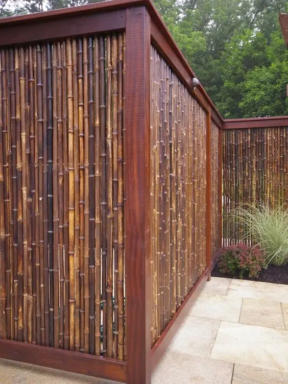 Bamboo Privacy Fence: Bamboo screening rolls from the hardware store, fixed inside a timber frame