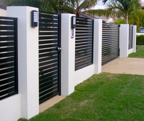 Modern Black Horizontal Slats fence: Black steel slats over a white rendered base, and the contrast does all the work