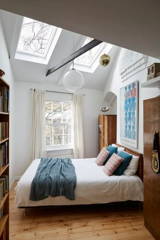 small bedroom with skylights