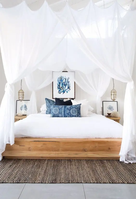 luxurious white canopied bedroom