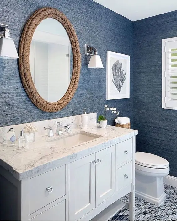 Ocean Blues powder room: Bring in the posh Hamptons vibe with this coastal powder room design. The cool interiors feature a