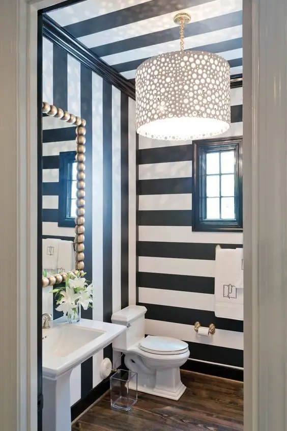 Dazzling 80s powder room: This powder room brings back the vivacious and energetic 80s! The retro stripes, ball-lined