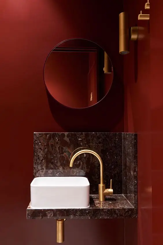 Glam Red powder room: Nobody will notice the size of this powder room if it looks this fabulous! Combine wine red with