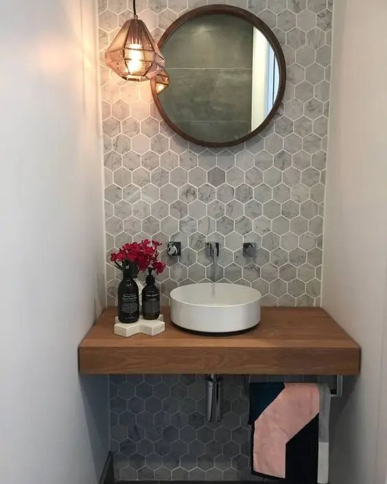 Scaled-Down Efficiency powder room: Efficient layout counts more than the square footage. This scaled-down powder room is